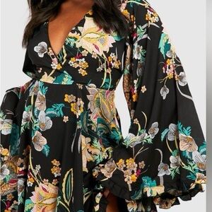 Boohoo plus black floral dress with bell sleeves.
